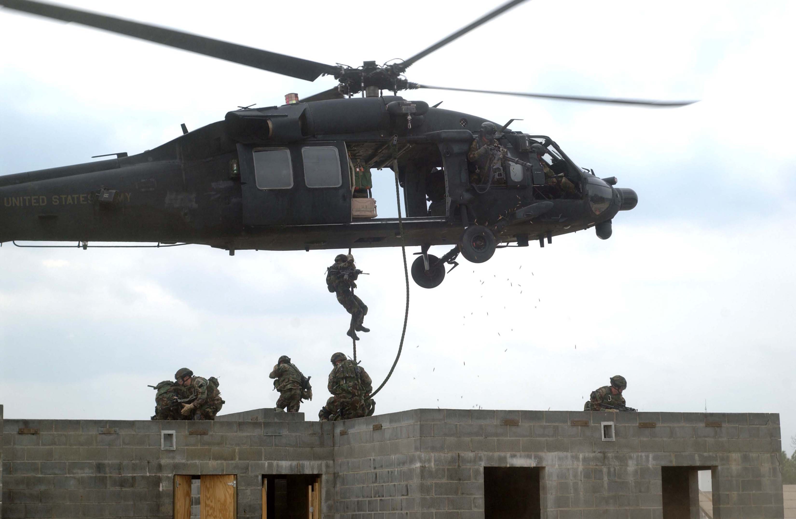Military helicopter flight operations dramatic sky